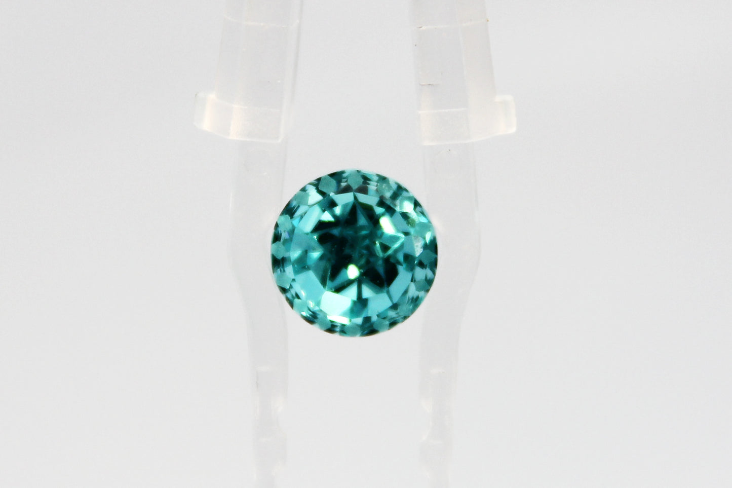 “Covenant Eye” Round Cut Paraiba-color Lab-grown Garnet