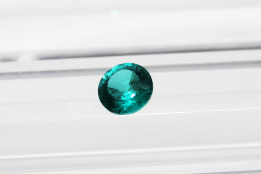 Round-cut Paraiba-color Lab-grown Garnet